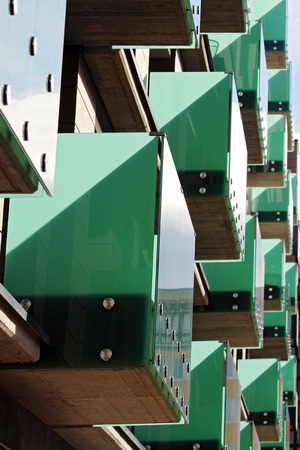 detail of modern green glass balcony during sunny dayの写真素材