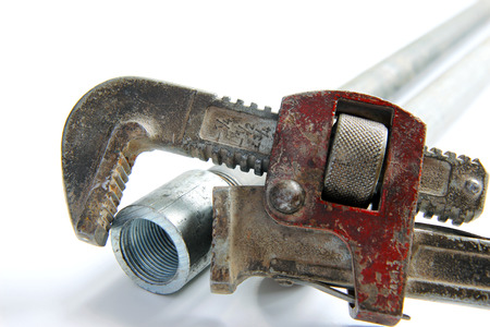 pipe wrench with water pipes on white backgroundの写真素材