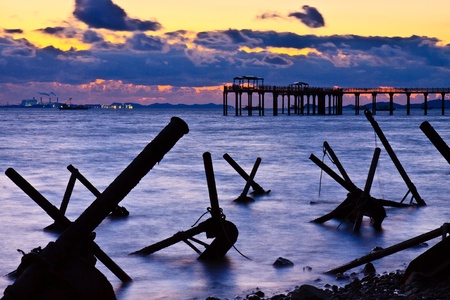 Seascape with obstacle by sunsetの写真素材