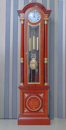 large wooden clock on the floorの写真素材
