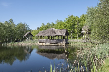 Hut on an old pond on stiltsの写真素材