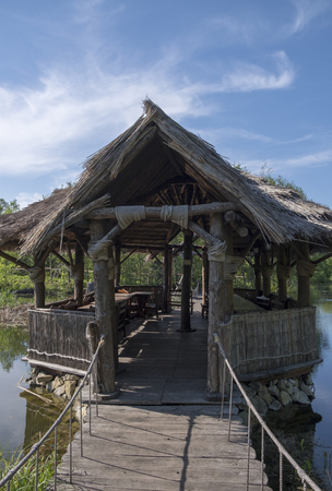 Hut on an old pond on stiltsの写真素材