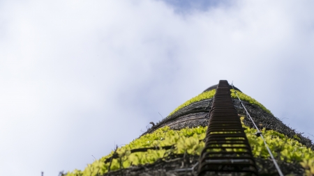 factory chimney with stairs to the blue skyの写真素材