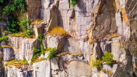 Old stone quarry wall with drill marksの写真素材