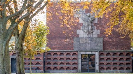 Sondermarken Crematorium in Frederiksberg Denmark with a Sad 1930s style angel  and  Alpha and Omega above the entrance,の写真素材