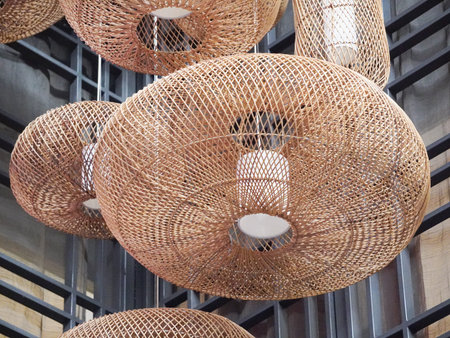 Hanging rattan lamp in a shop, closeup of photoの写真素材