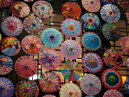Colorful paper umbrellas in a shop in Barcelona, Catalonia, Spainの写真素材