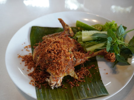 Fried frog with garlic on banana leaf,Thai food.の写真素材