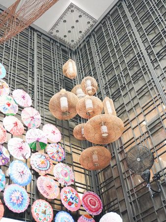 Colorful umbrellas hanging on the ceiling of a shop.の写真素材