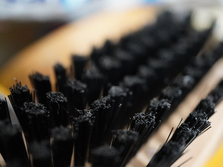 Close up of black plastic brush for cleaning in the bathroom. Selective focus.の写真素材
