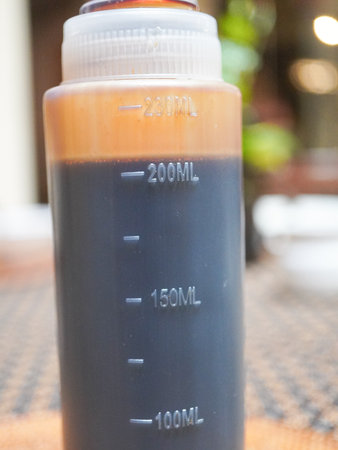 Coffee in a plastic bottle on the table, stock photoの写真素材