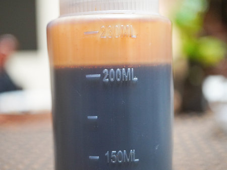 Coffee in plastic bottle on table at coffee shop, stock photoの写真素材