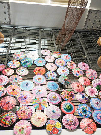 Colorful umbrellas hanging in a shopping mall, Thailand.の写真素材
