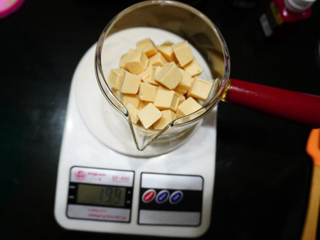 Close up of cubes in a blender on the kitchen scale.の写真素材