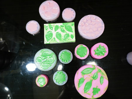 Colorful handmade soap bars on black background, closeup of photoの写真素材