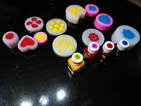 Close up of colorful paint bottles on black background with copy spaceの写真素材