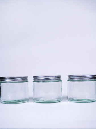 Empty glass jars on a white background. The concept of storage.の写真素材