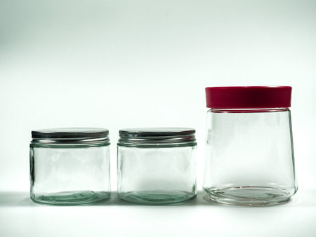 Empty glass jars on white background with copy space for your text.の写真素材