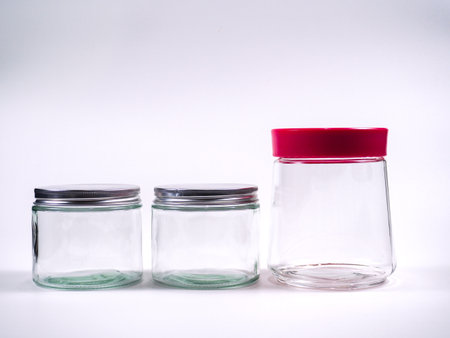 Empty glass jars on white background.の写真素材