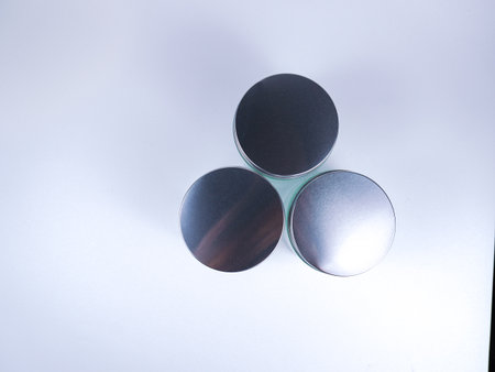 Metallic circular objects isolated on a white background with copy space.の写真素材