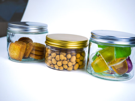 Jars with candies on a white background.の写真素材