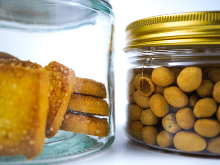 Biscuits in a glass jar on a white background.の写真素材