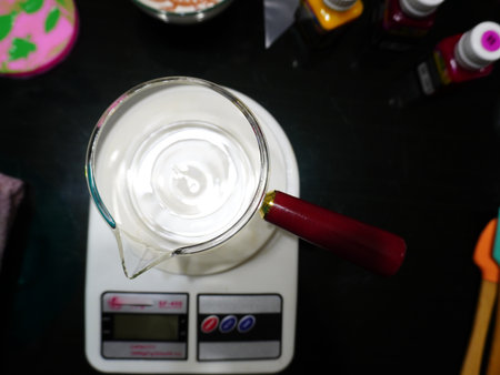 A glass jar on the scale. Top view.の写真素材