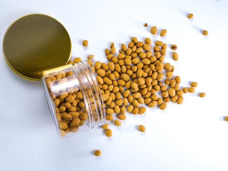Roasted soybeans in a jar on a white background.の写真素材