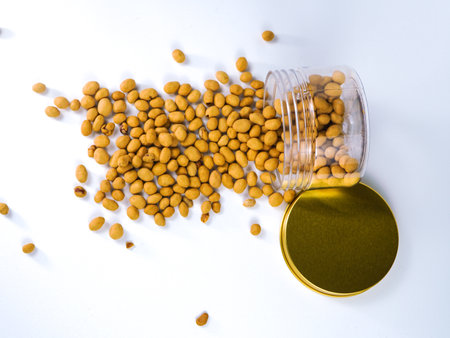 soy bean in glass jar on white background, top view.の写真素材