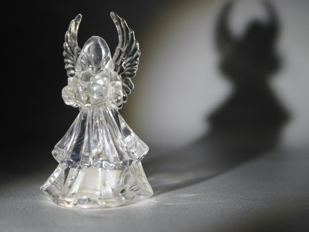 Angel figurine on a dark background. Shallow depth of field.の写真素材