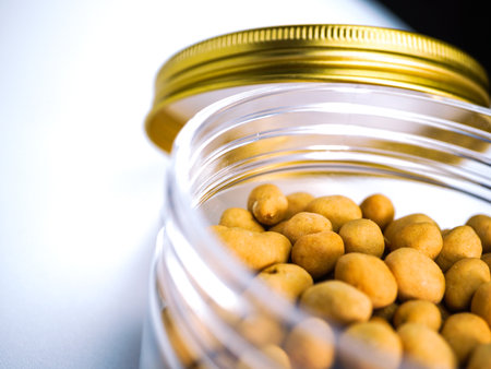 Roasted chickpeas in a jar on a white background.の写真素材