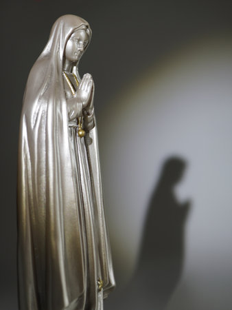 Statue of Virgin Mary with the shadow of the hand of Jesusの写真素材