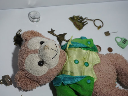 Teddy bear toy and accessories on white background, closeup of photoの写真素材