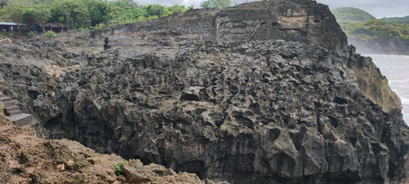 Rocks and cliffs on the coast of the island of Baliの写真素材