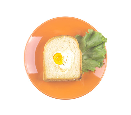 toast with an egg in the shape of a heart. Fried bread.の写真素材