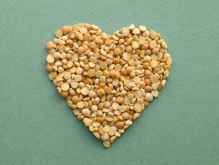 Heart shape made from dry orange peasの写真素材