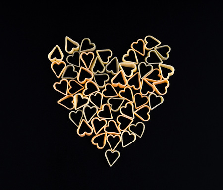 Heart shape made of  pasta. Pasta in the shape of a heart on a bの写真素材