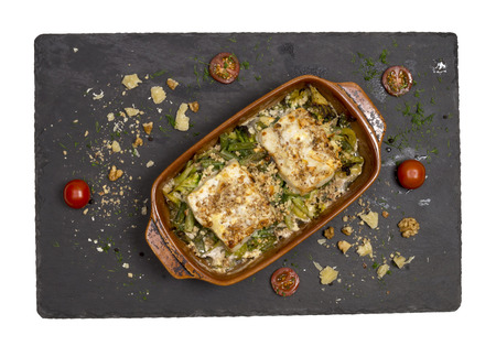 Fish dish fried fish fillet and vegetables.の写真素材