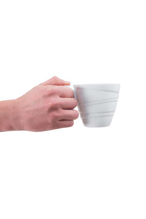 Man in a red shirt is holding a white coffee mug in his handの写真素材