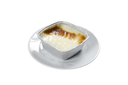 Turkish traditional dairy style rice pudding (sutlac) served on white backgroundの写真素材