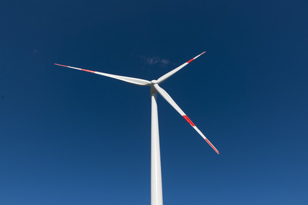 Wind turbines generate electricity with blue skyの写真素材