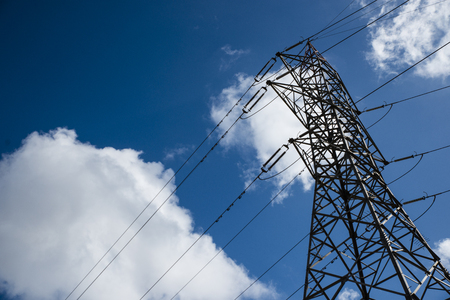 High voltage pole, clouds, blue skyの写真素材
