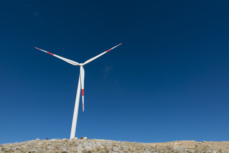Wind turbines generate electricity with blue skyの写真素材