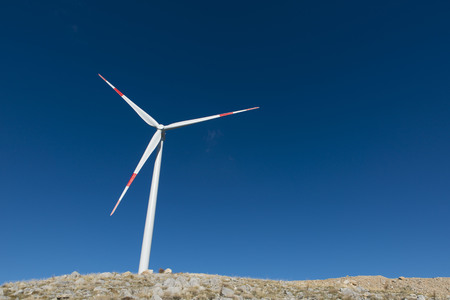 Wind turbines generate electricity with blue skyの写真素材