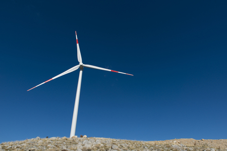 Wind turbines generate electricity with blue skyの写真素材