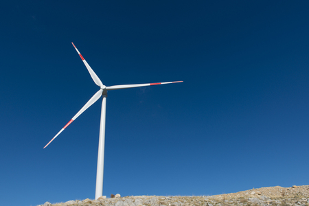 Wind turbines generate electricity with blue skyの写真素材