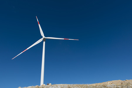 Wind turbines generate electricity with blue skyの写真素材