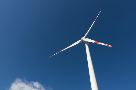 Wind turbines generate electricity with blue skyの写真素材