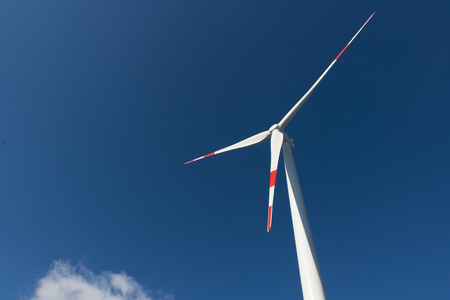 Wind turbines generate electricity with blue skyの写真素材