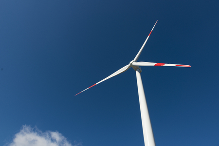 Wind turbines generate electricity with blue skyの写真素材